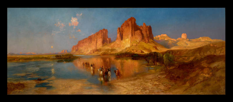 A luminous painting of the American West by Thomas Moran. A small party of riders on horseback fords a broad, glassy expanse of shallow water that mirrors the red sandstone cliffs and buttes rising behind them, all beneath a wide, cloudless blue sky.